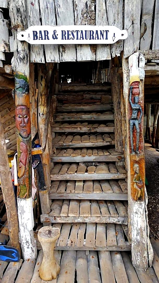 Rustic bar and restaurant entrance at Lamin Lodge
