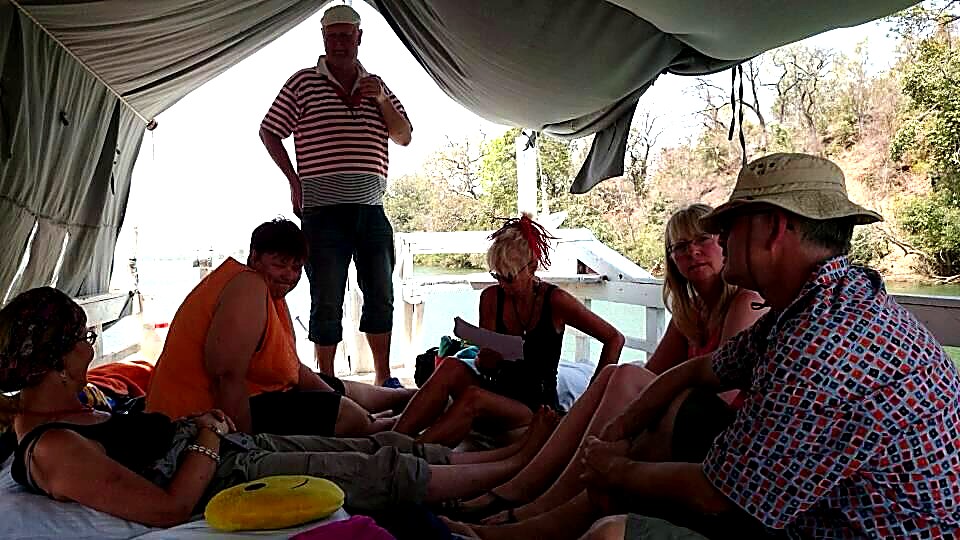 Guests relaxing inside a cruise boat cabin