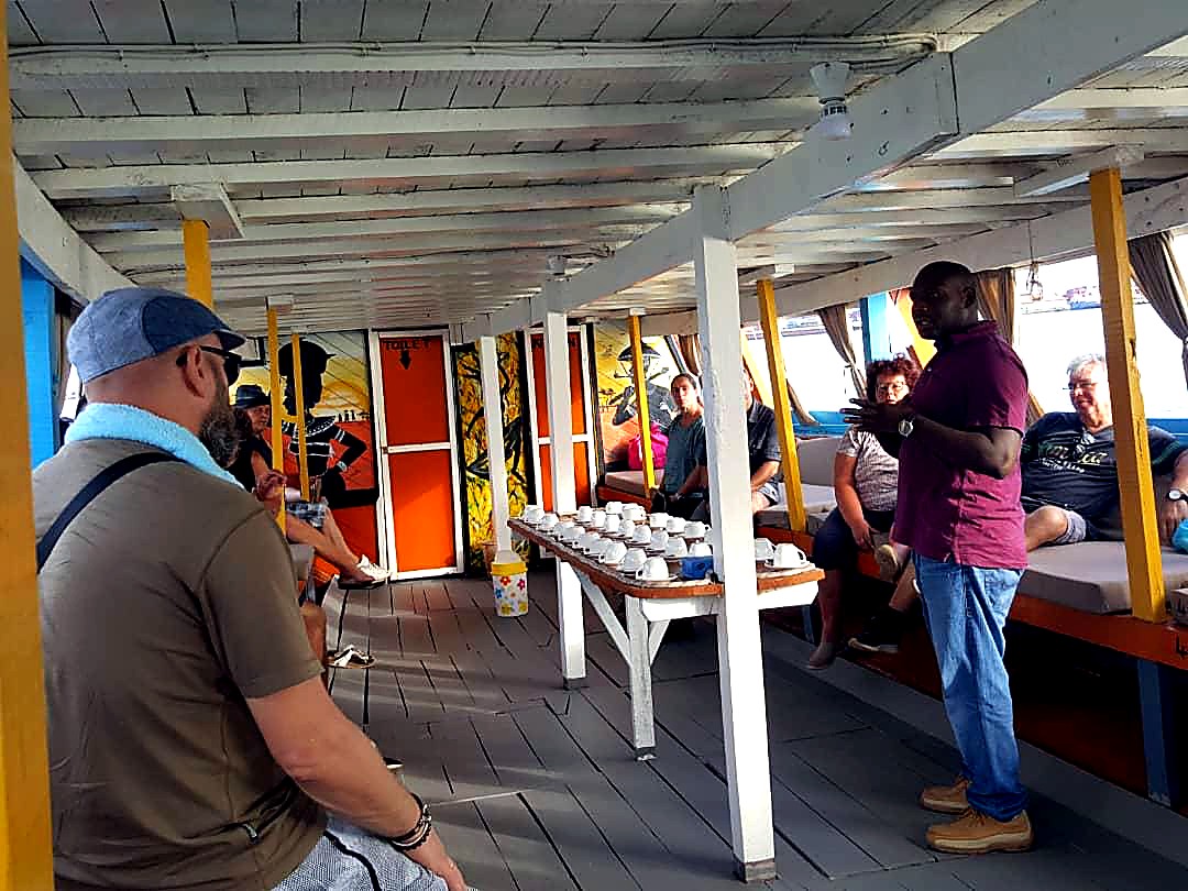 Guide speaking to guests on board