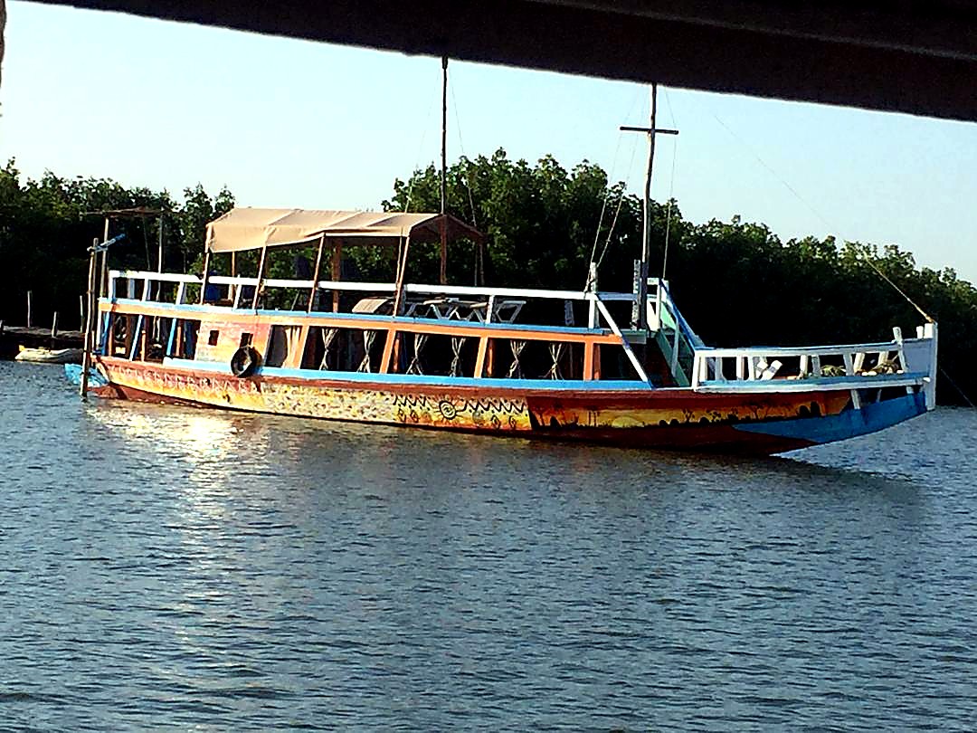 Wooden boat moored near Lamin Lodge