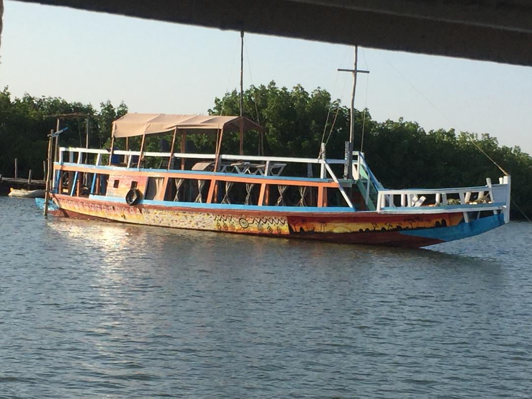 Wooden river cruise boat on calm water
