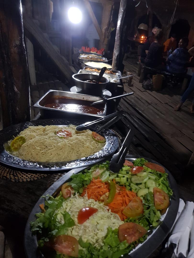 Buffet with salads, noodles and Gambian dishes at Lamin Lodge